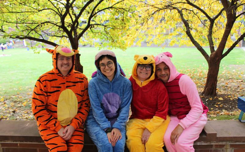 Pride Center Professional staff in Winnie The Pooh Character onesie pajamas